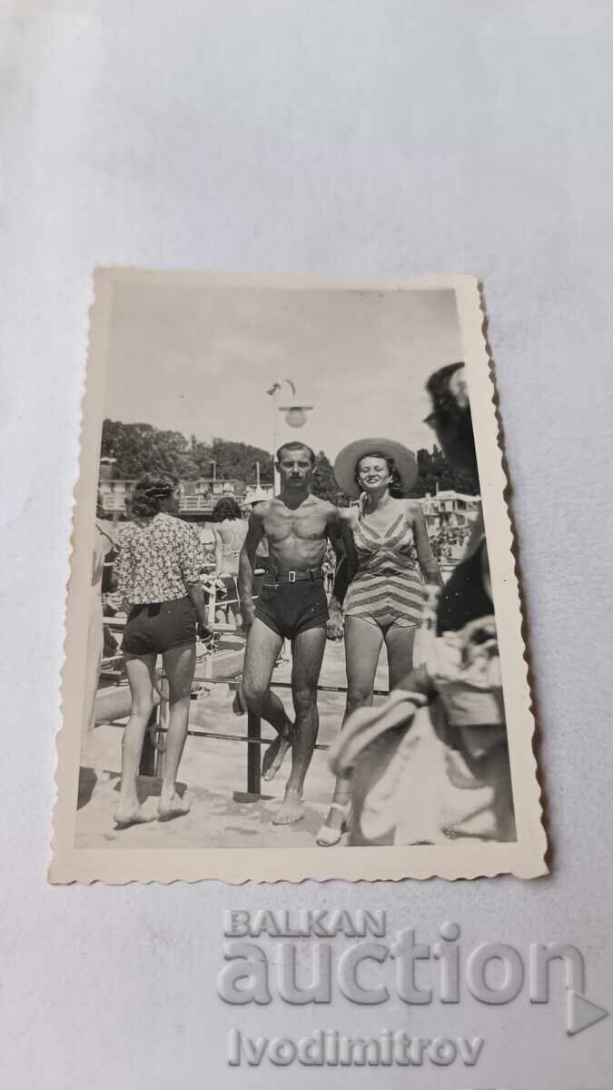 Photo of a Young Man and a Young Woman on the Beach Photo of a Young Man and a Young Woman on the Beach