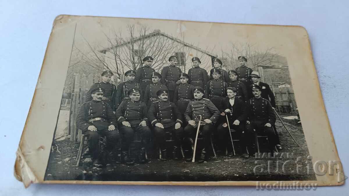 Photo of Police Officers with their Chief and two men