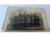 Photo of Police Officers with their Chief and two men