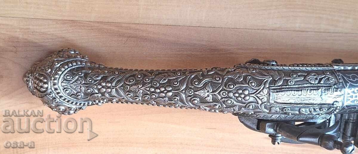 A pistol, a rifle, a revolver - 12