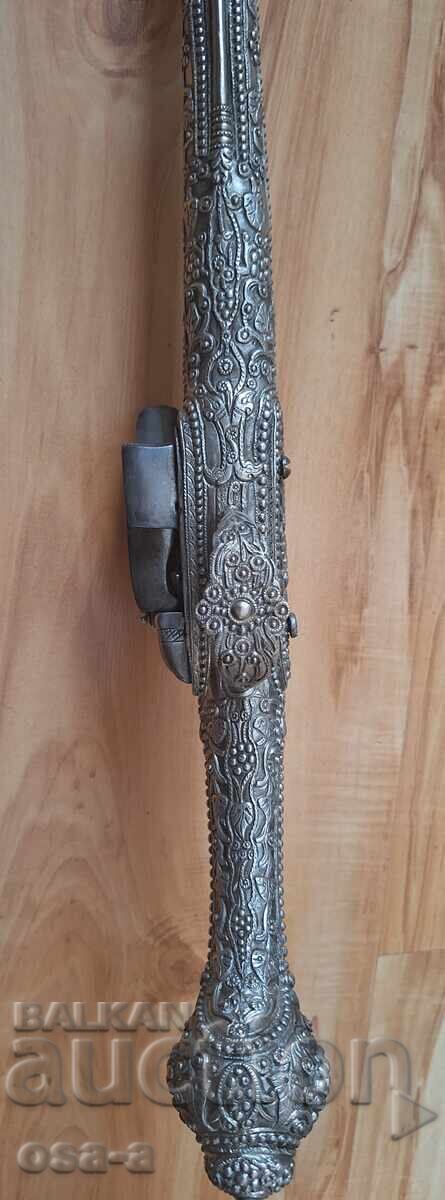 A pistol, a rifle, a revolver - 13