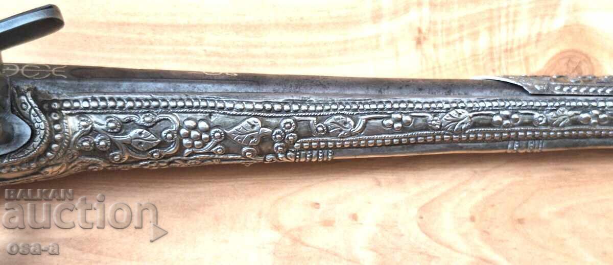 A pistol, a rifle, a revolver - 7