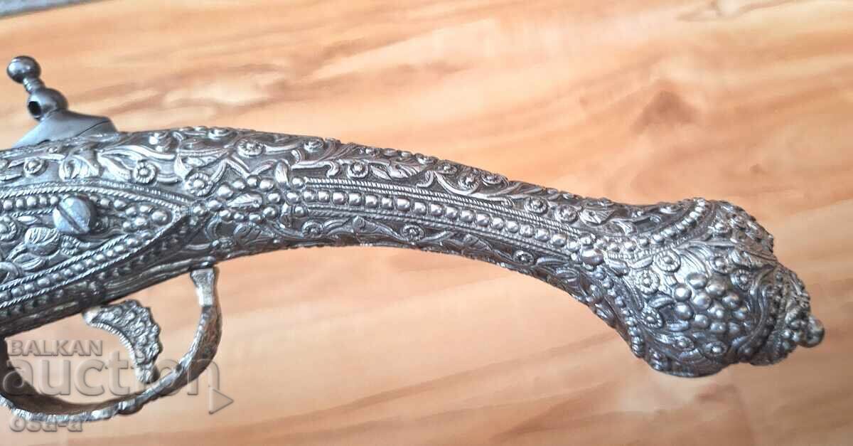 A pistol, a rifle, a revolver - 8