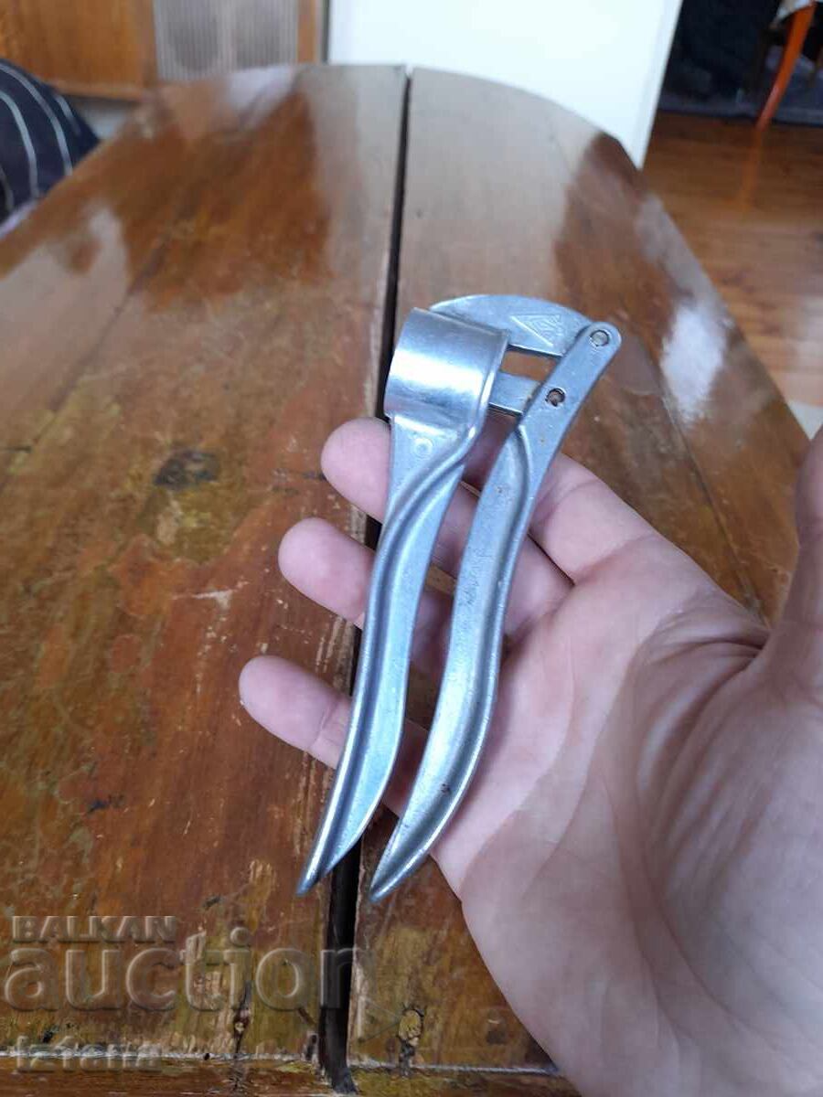 Auction  Old aluminum garlic press