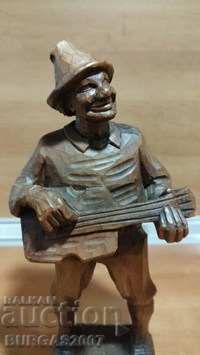 Delivery of Old wooden figure, musician with guitar, 30 cm. Delivery of Old wooden figure, musician with guitar, 30 cm.