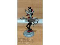 Old metal figure with a guitar opener, from "Well, guess!"