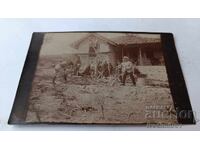 Photo of Boys and Girls Working in the Yard of a Village House