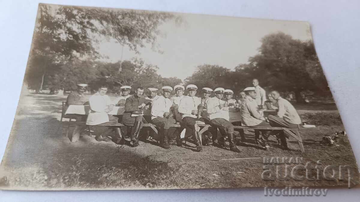 Photo: Officers sitting at a long wooden table Photo: Officers sitting at a long wooden table