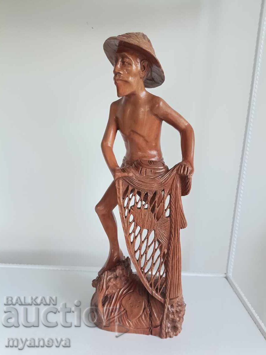 Delivery of Wood carving of a fisherman from Indonesia