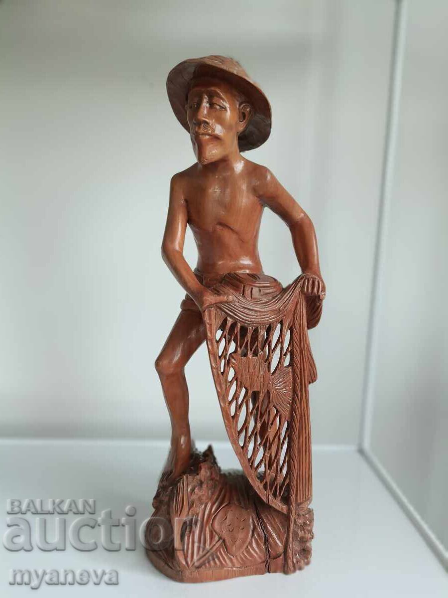 Wood carving of a fisherman from Indonesia