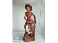 Wood carving of a fisherman from Indonesia
