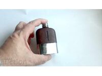 Old small pocket flask for alcohol