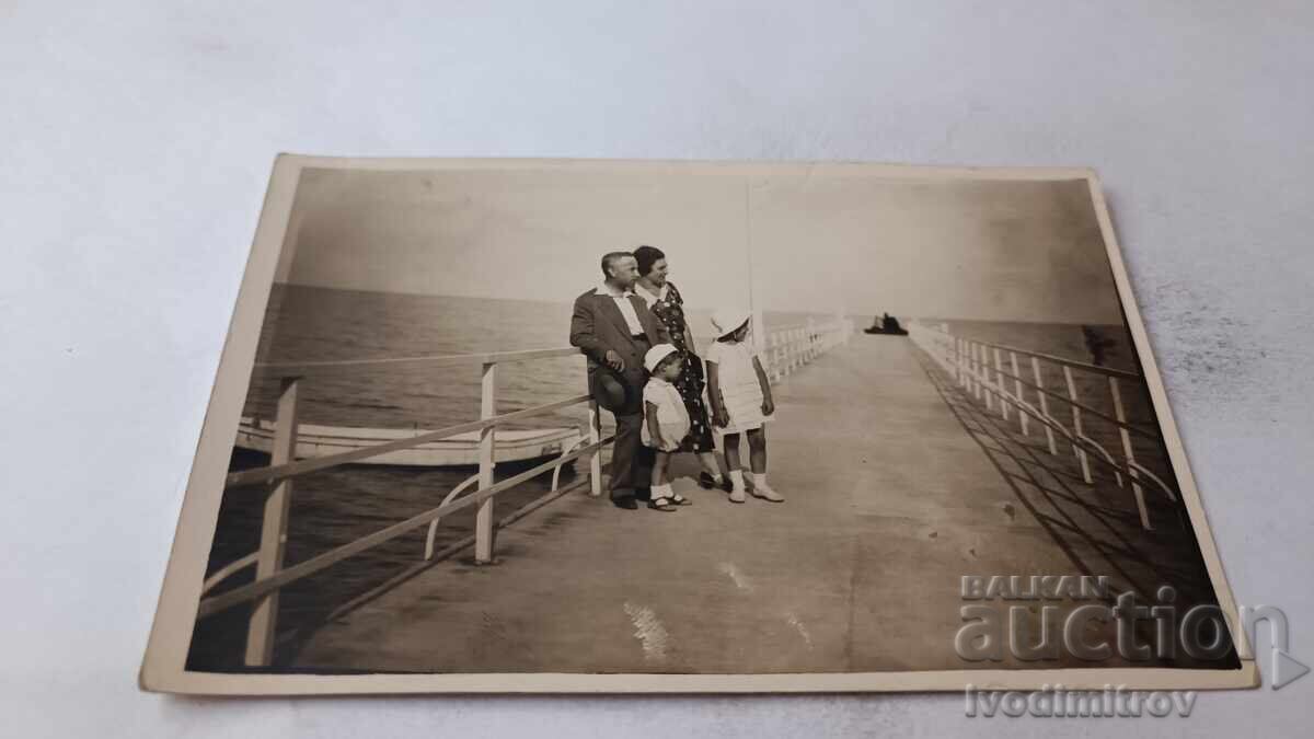 Photograph of St. Constantine, man, woman and two children on the pier, 1932