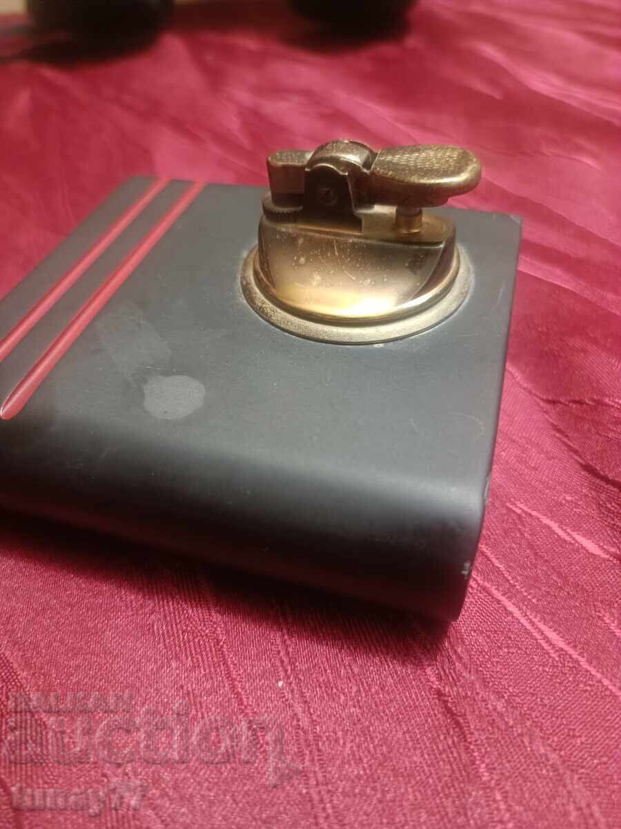 Auction  Retro bronze lighter from two parts with a massive stone base