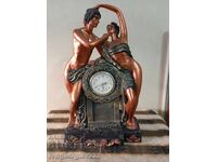Figurative table/mantel clock
