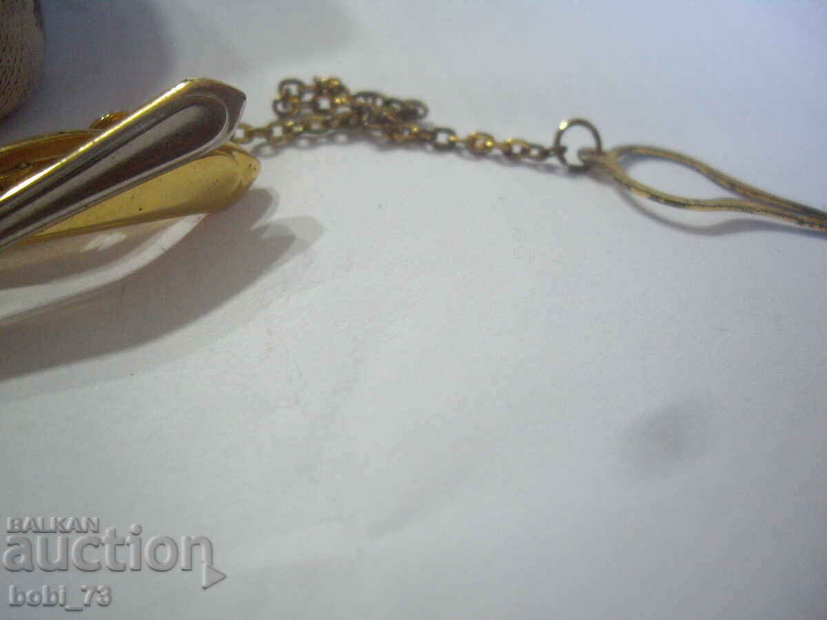 Delivery of Gold plated tie pin.