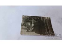Fotografie Sofia Doi bărbați lângă gard de lemn de casă 1955