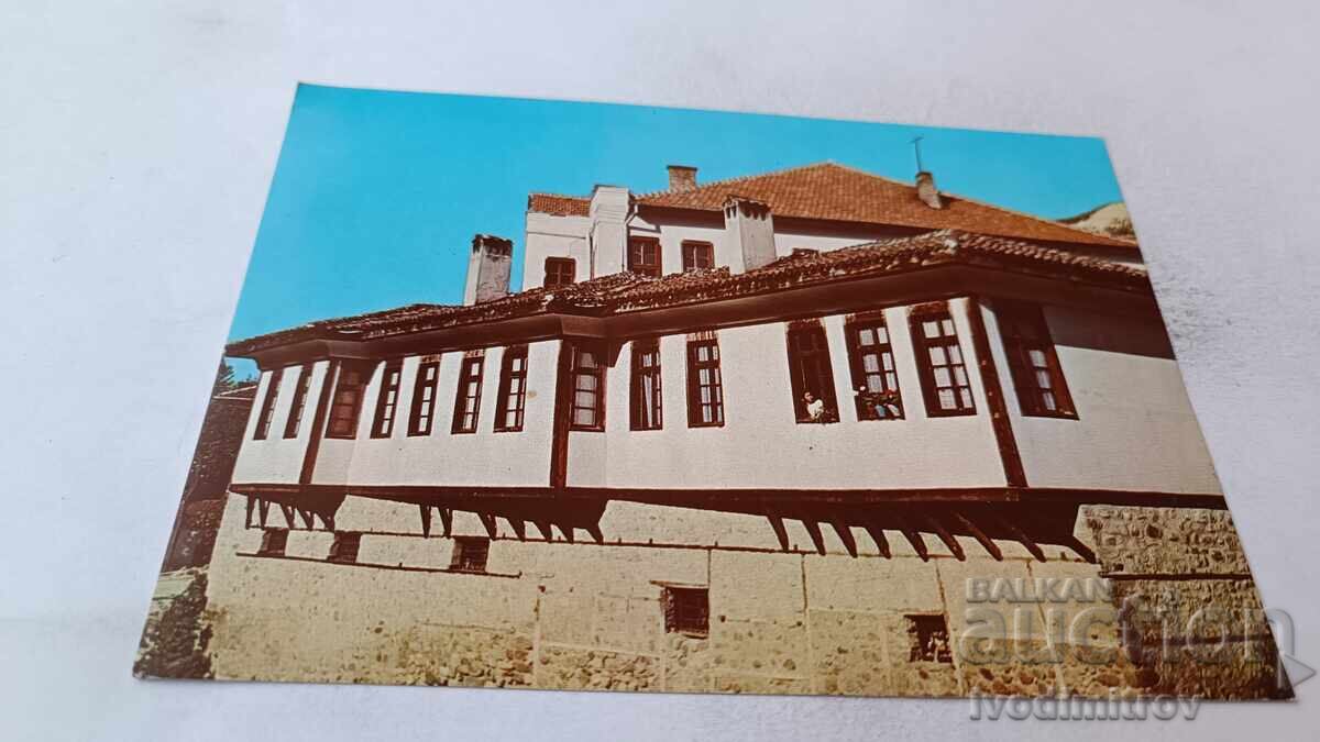 Ευχετήρια κάρτα Μελνίκ, Σπίτι Ουζούνοβα