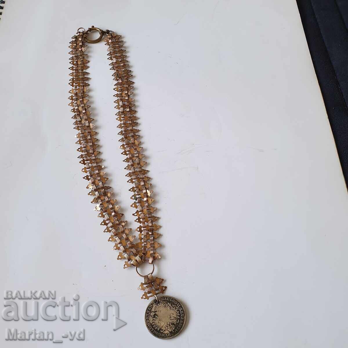 Antique jewelry from a double with a silver coin