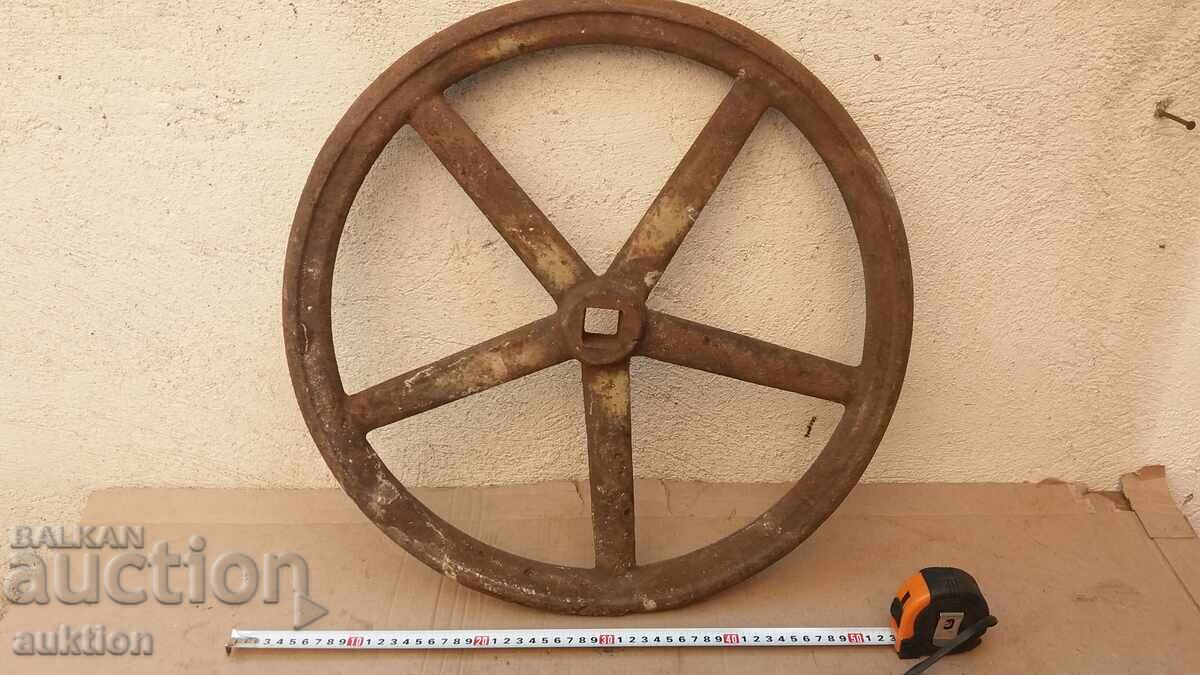 Auction  MASSIVE METAL CAST IRON WHEEL - REVIVAL