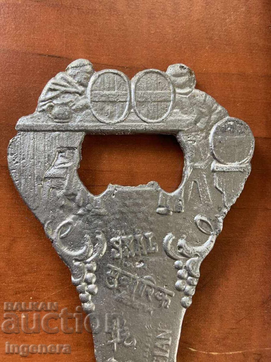 Auction  Cast iron opener with socle ornaments