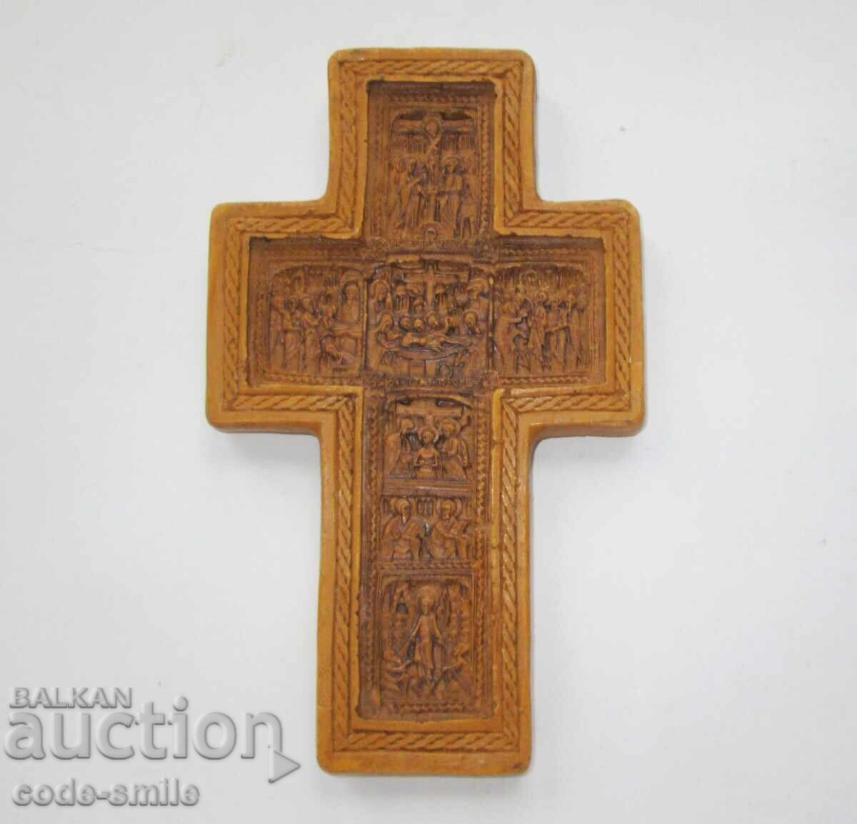 Large, old cross with religious scenes cast from wax