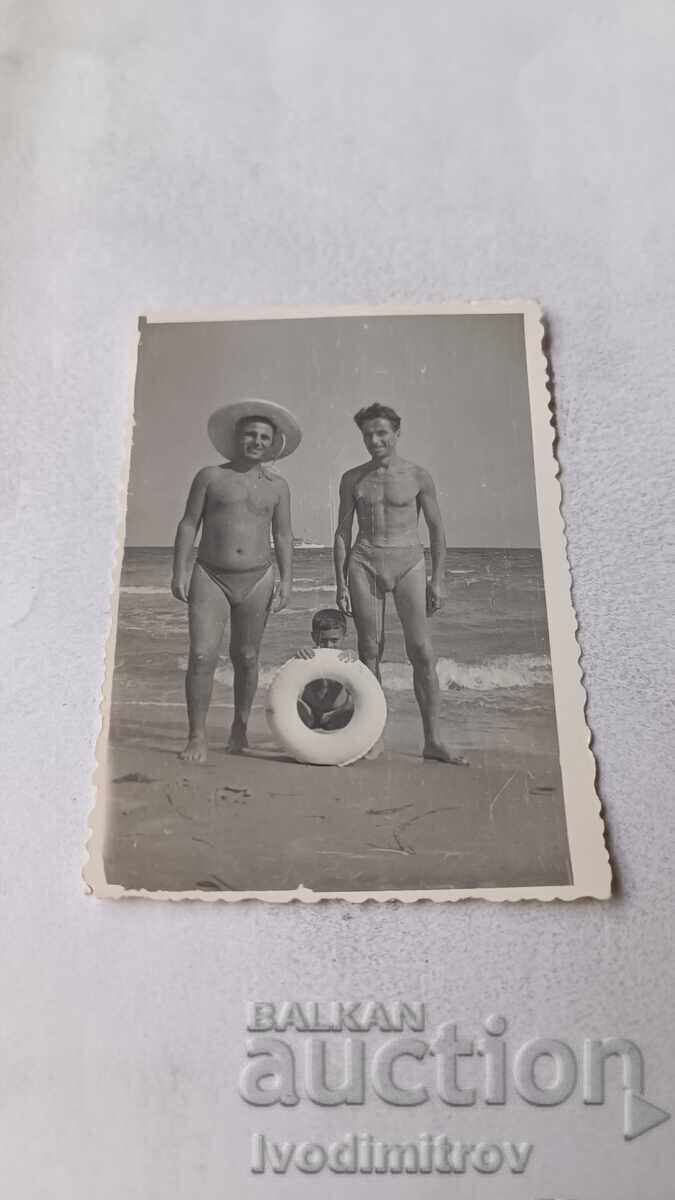 C-ka Nessebar Men and a little boy with a life preserver on the seashore 1961