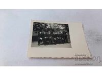 Photograph Sofia Students from 6th grade sitting on a bench in the park 1943