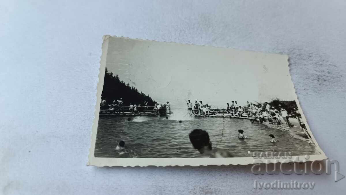 Photo of Young People in a Swimming Pool Photo of Young People in a Swimming Pool