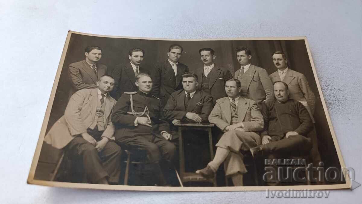 Photo of an Officer and a Group of Men Photo of an Officer and a Group of Men