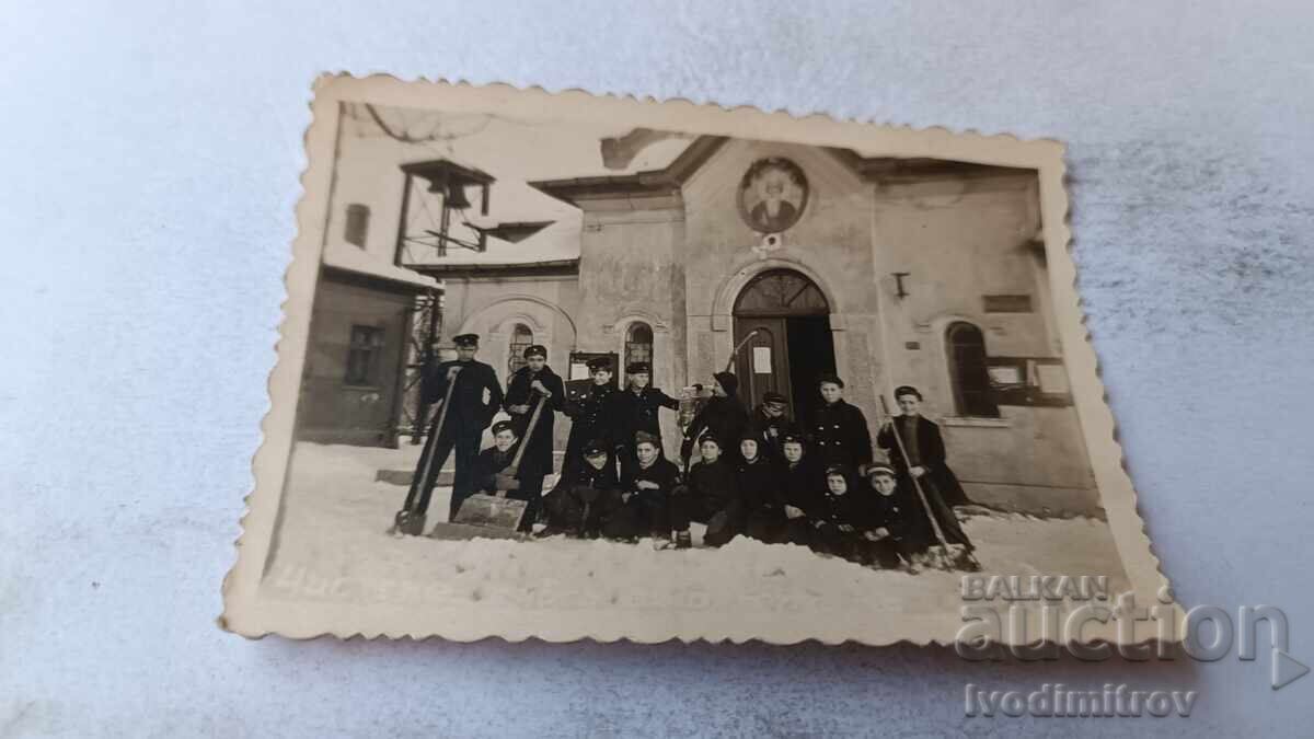 Photograph of Young People Clearing Snow in Front of a Church in Winter 1943