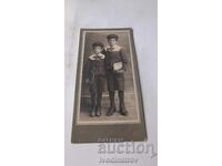 Fotografie Doi băieți în uniforme școlare Carton