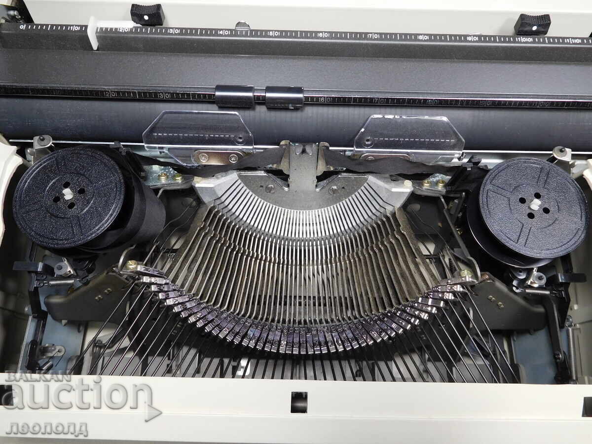 Delivery of OLD RETRO PORTABLE TYPEWRITER OLYMPIA CARINA 2