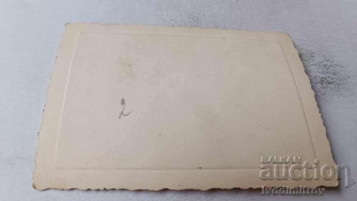 Auction Photo of a Young Person on a Square with Retro Cars Auction Photo of a Young Person on a Square with Retro Cars