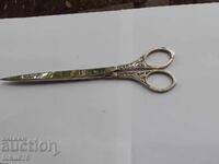 Old scissors with enamel