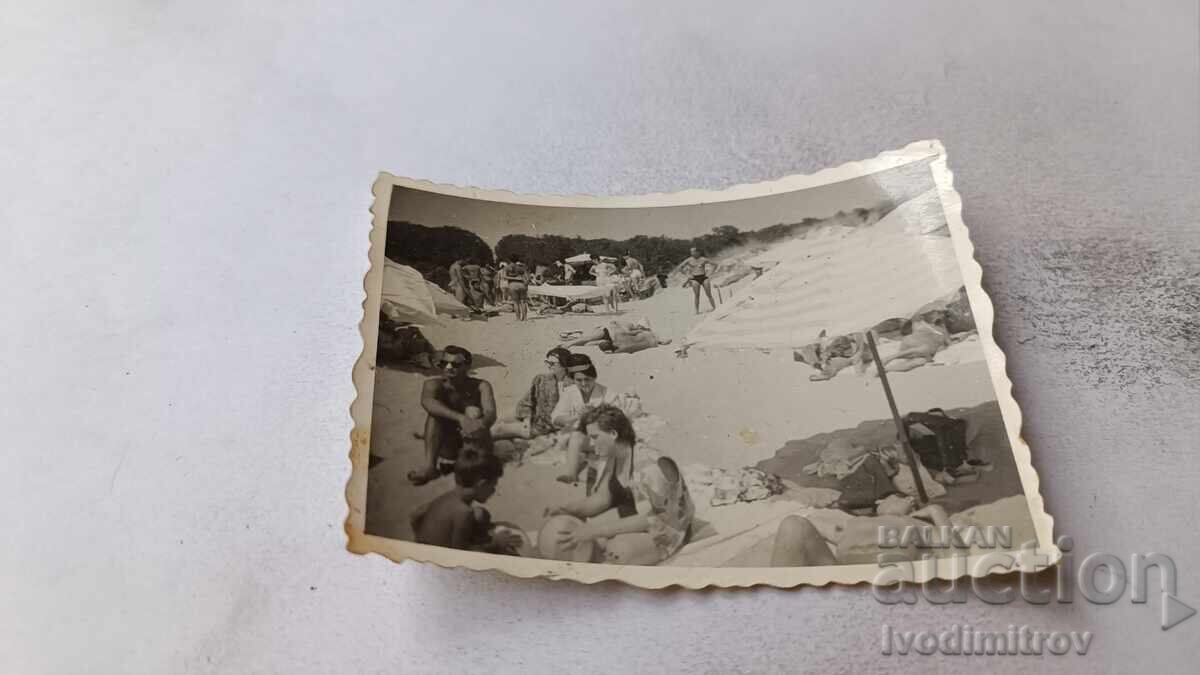 Photo Women and children on the beach Photo Women and children on the beach