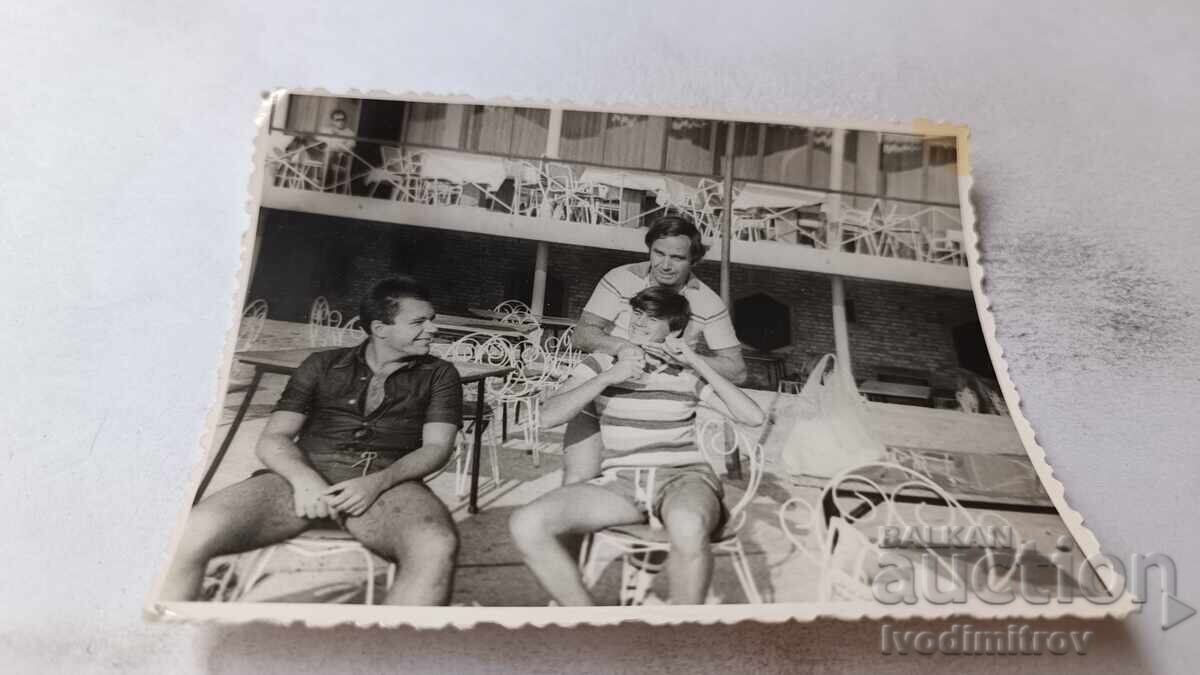 Photo of Three Men in a Pastry Shop