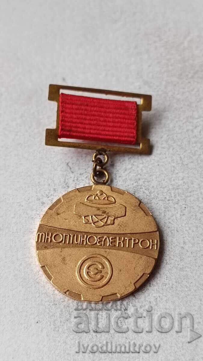 Σηματάκι 10 χρόνια MK Οπτοηλεκτρον Παναγυρίστε