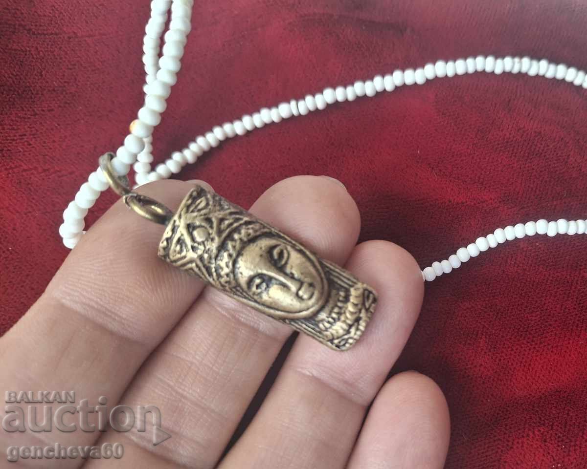 Delivery of Beautiful antique bronze amulet totem, beads