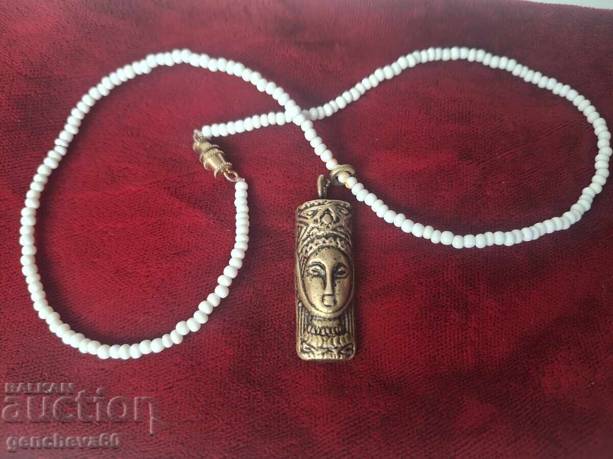 Beautiful antique bronze amulet totem, beads