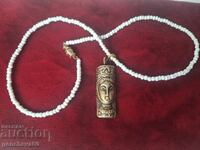 Beautiful antique bronze amulet totem, beads