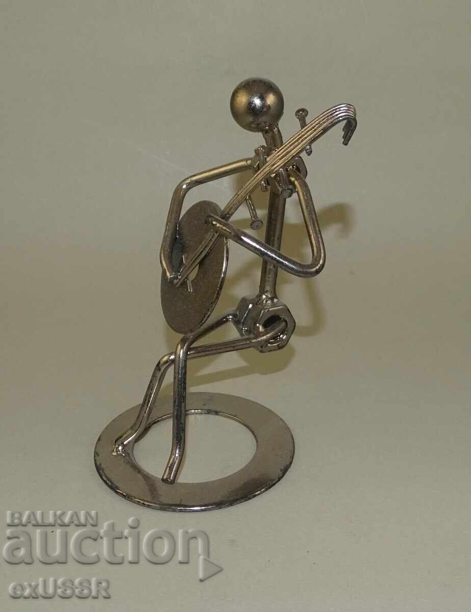 Auction  Metal musician figure, nuts