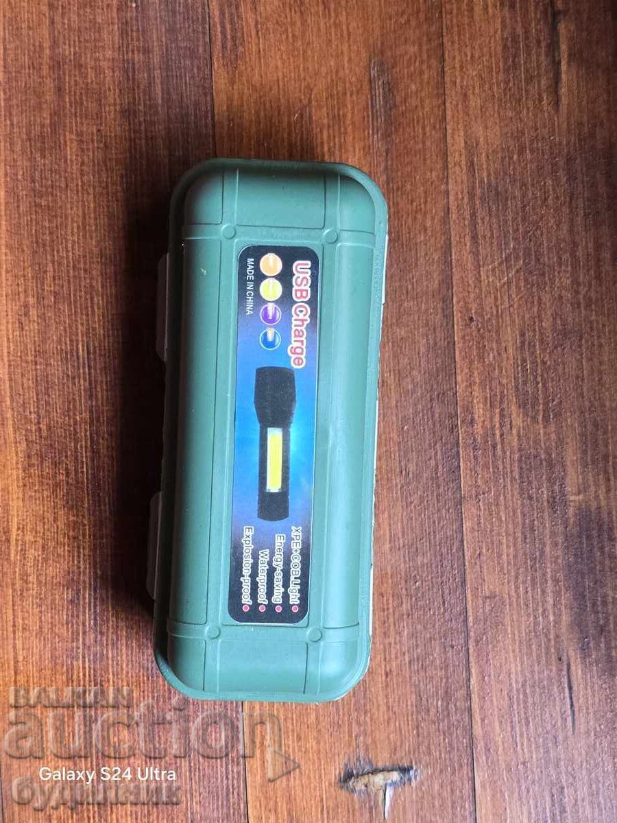 Delivery of Brand new super powerful flashlight with USB cable. I'm listing it on
