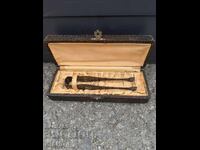 Old silver-plated ice tongs with a box