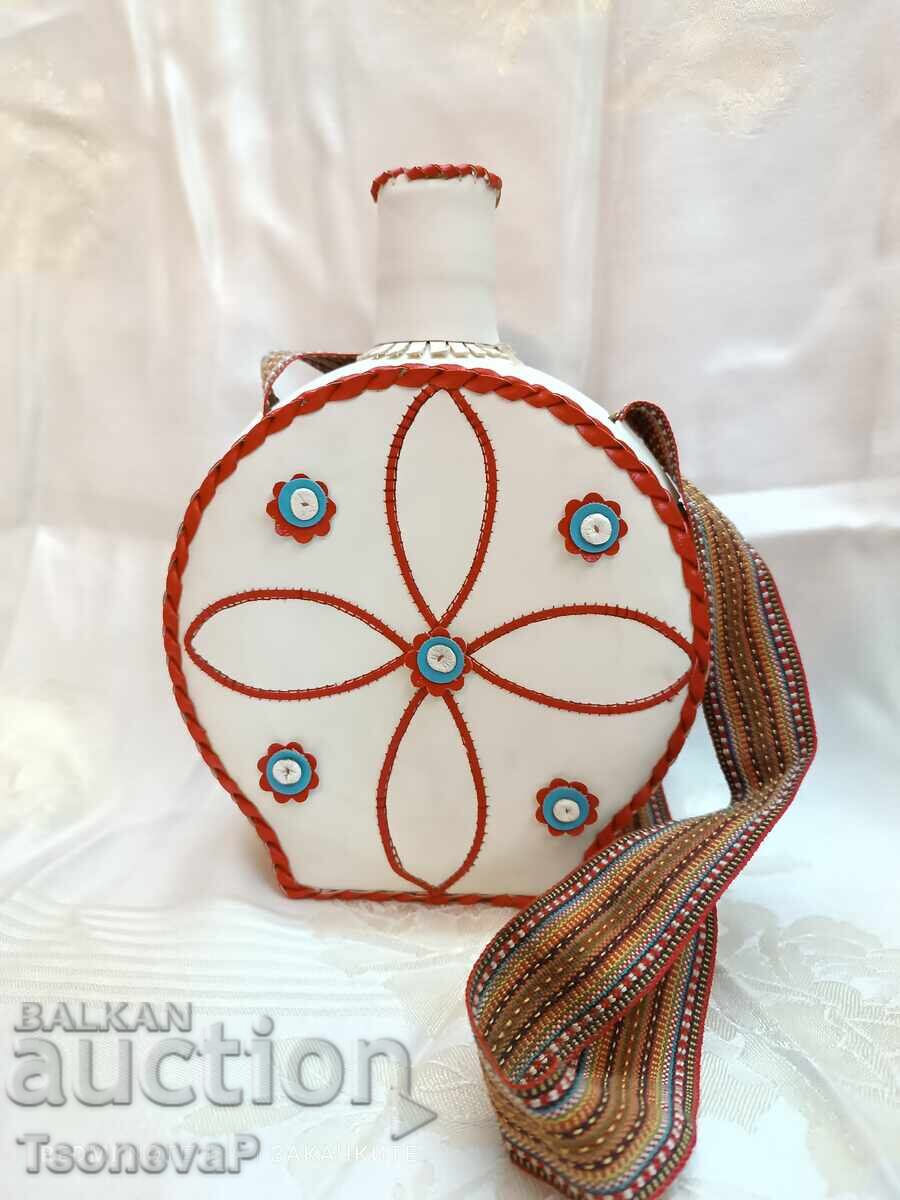 Glass flask with a lid, hand-covered in leather Glass flask with a lid, hand-covered in leather