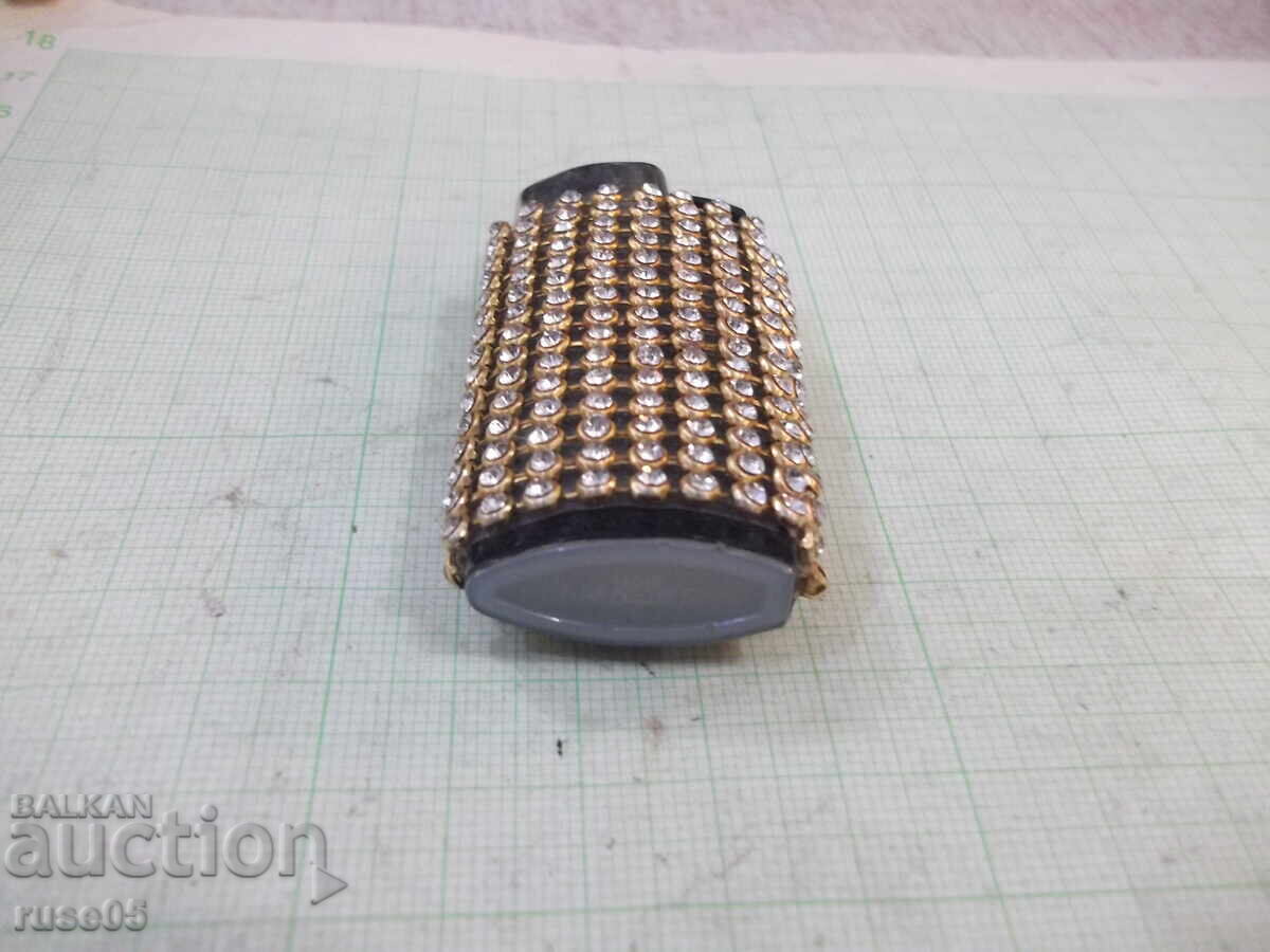 Auction Clipper gas lighter with soft flame, encrusted with stones Auction Clipper gas lighter with soft flame, encrusted with stones