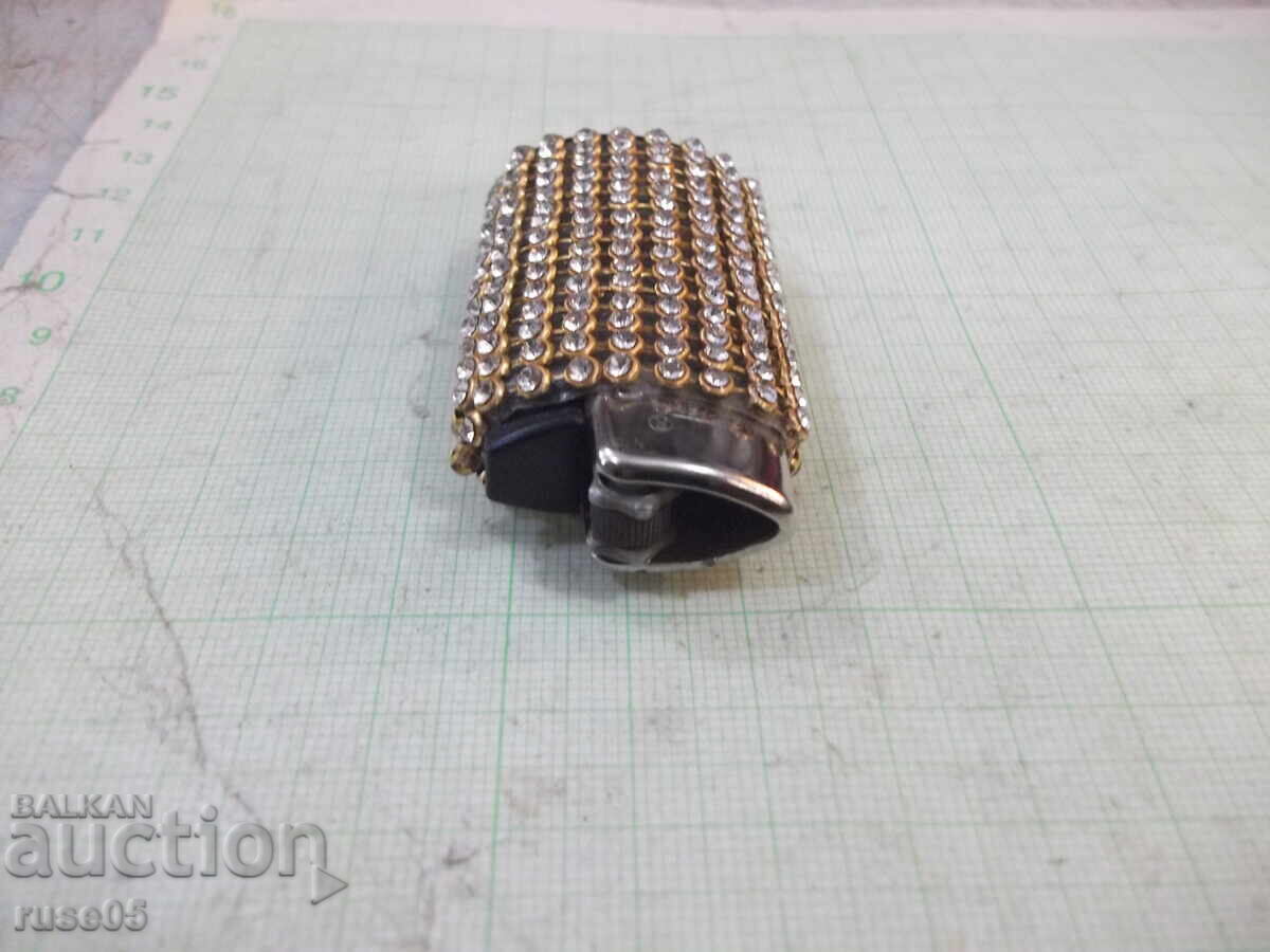 Delivery of Clipper gas lighter with soft flame, encrusted with stones Delivery of Clipper gas lighter with soft flame, encrusted with stones