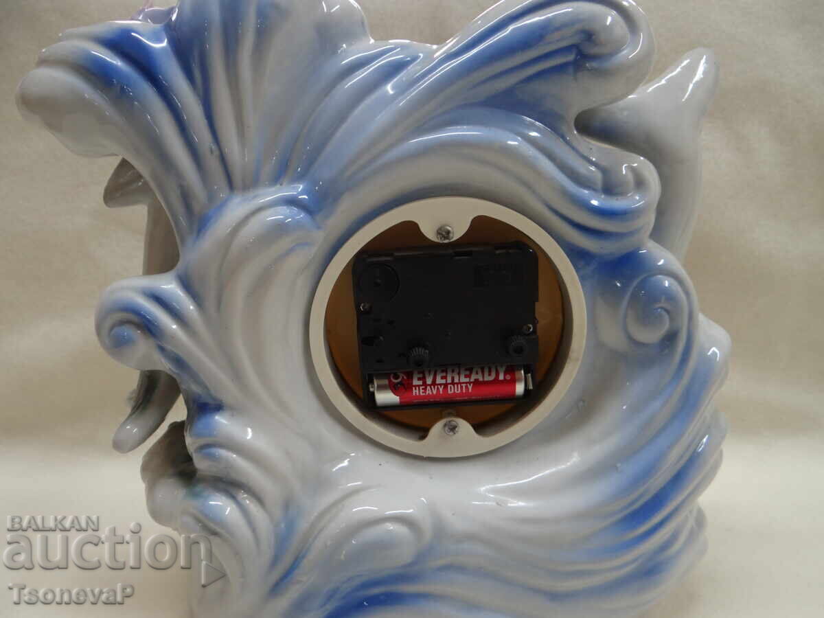Auction Porcelain clock with dolphins and flowers, working Auction Porcelain clock with dolphins and flowers, working