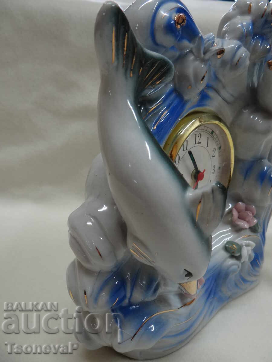 Delivery of Porcelain clock with dolphins and flowers, working Delivery of Porcelain clock with dolphins and flowers, working
