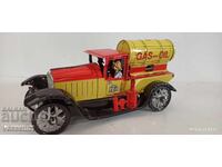 Old sheet metal truck with a wind-up friction mechanism